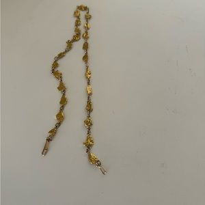 A 14kt yellow gold nugget necklace. necklace measures approx. 19".